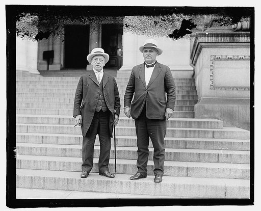 Samuel Gompers and Frank Walker.] One figure holding cane at side