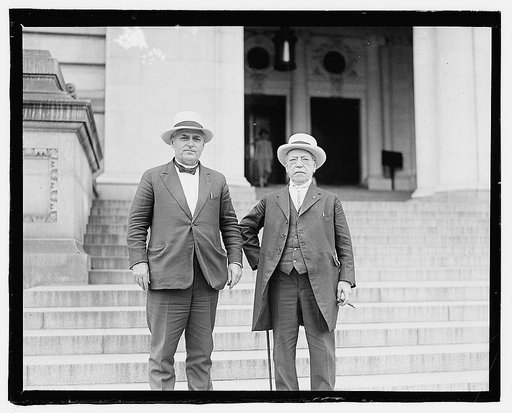 Samuel Gompers and Frank Walker.] One figure holding cane at side