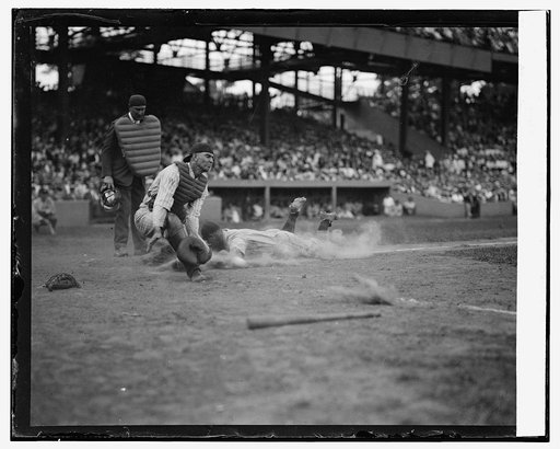 Yankees Lou Gehrig scores head first in 4th inning as Joe Harris' throw gets away from catcher Hank Severeid of Senators. Umpier  [Umpire] is Nallin. Yanks beat Senators 3-2 (baseball)