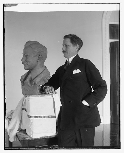 War Secretary poses for bust by noted sculptor. Secretary of War Patrick J. Hurley posing for the final touch of a bust of himself which is nearing completion at the hands of Edgardo Simone, noted Italian sculptor, who has been modeling a number of prominent personages at his studio in Washington