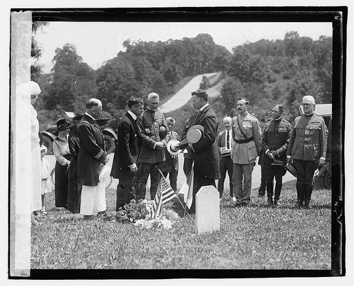Secty. Baker, General March & [...] DeBerne decorating grave of French soldiers