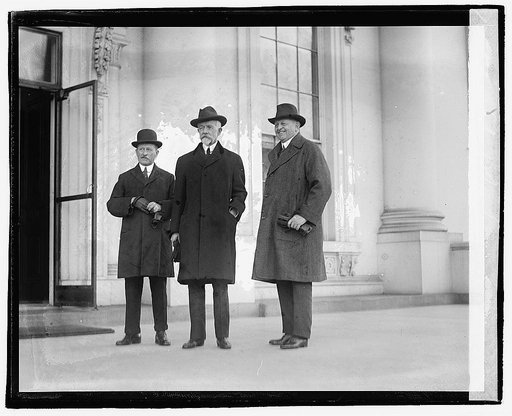 Three men standing outside building], 12/6/20
