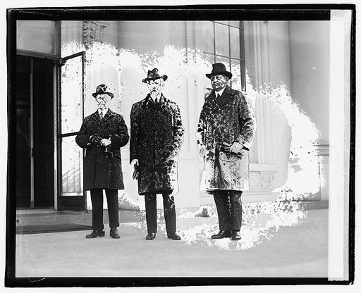 Three men standing outside building], 12/6/20