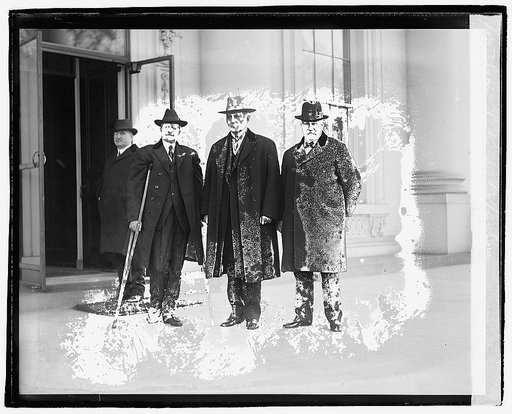 Four men standing outside building], 12/6/20