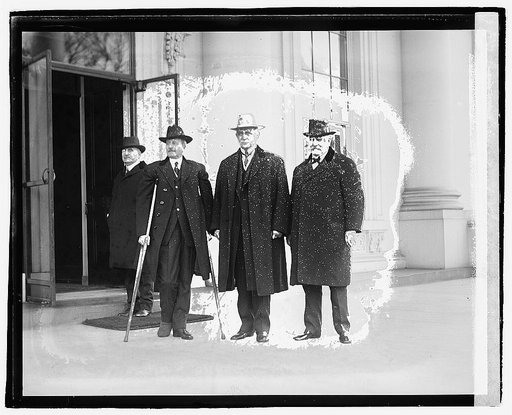 Four men standing outside building], 12/6/20