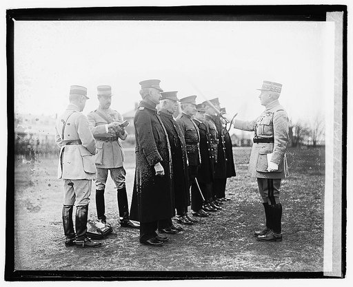 General Neville with sword in ceremony with group], 12/6/20