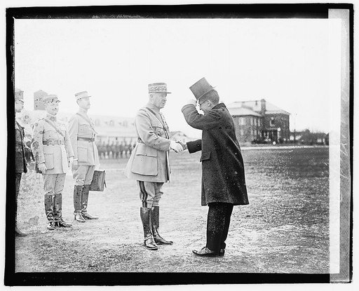 General Neville in handshake with Secretary Baker], 12/6/20
