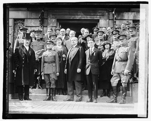 Captain Harmon Rorison (front, second from left) and Lt. Kenneth Shrewsbury (front, fourth from left) receiving the Virtuti Militari, Polish Legation, Washington, D.C.], 3/14/21