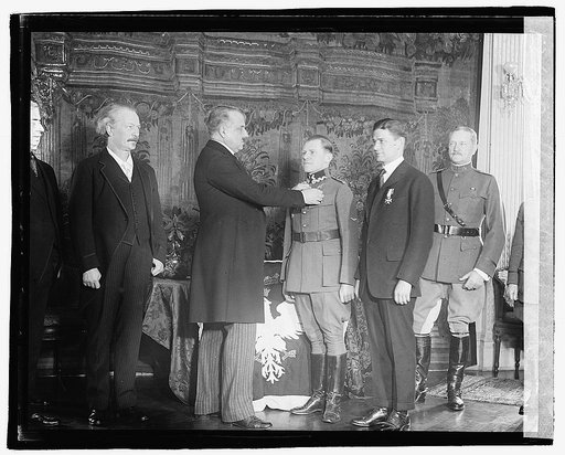 Prince Casimir Lubomirski, Polish envoy, presents the Virtuti Militari, Poland's highest military honor, to Capt. Harmon Rorison at the Polish Legation in Washington, D.C], 3/14/21