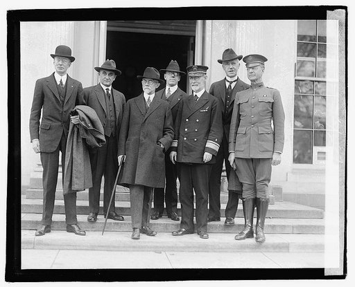 Group of men standing on steps outside building], 3/25/21