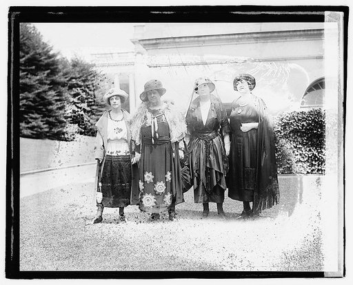 Four unidentified women standing near side of White House, Washington, D.C.,] 6/12/21