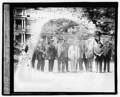 Group of unidentified men standing in front of State, War, and Navy Building, Washington, D.C.,] 6/12/21