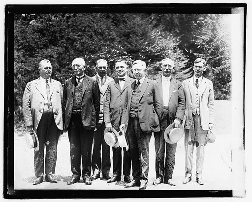 Group of seven unidentified men standing outdoors,] 6/27/21