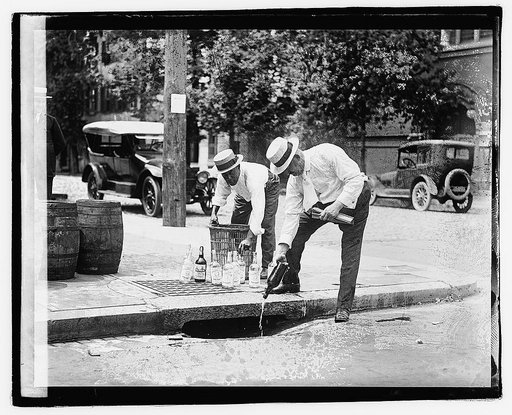 Two men pouring liquor into storm drain], 7/8/21
