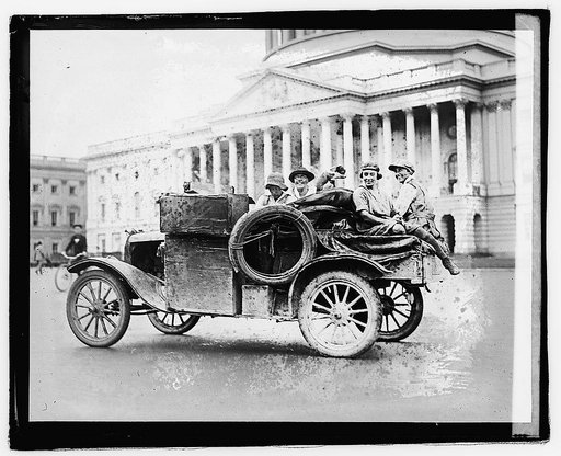 Unidentified persons in automobile in front of Capitol building], 9/21/21