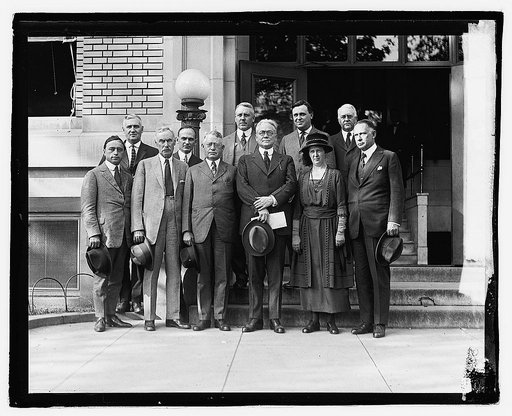 Group of unidentified men and woman outside city building], 9/29/21
