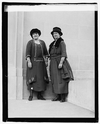 Two unidentified women outside city building
