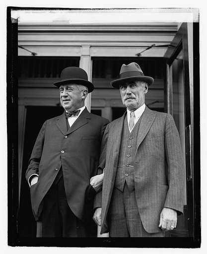 Two unidentified men outside city building