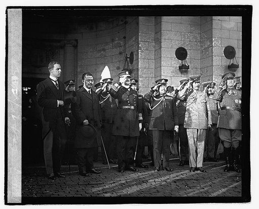 Admil. Kato & Maj. Gen'l. K. Tanaka and group saluting outside building], 10/24/21