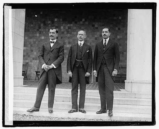 Three unidentified men standing on steps of building, 11/23/21
