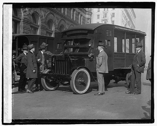 Postmaster General Will Hayes and other Post Office officials inspecting the new armoured trucks which it is proposed to put into use as a means of protection for the mails, 12/1/21