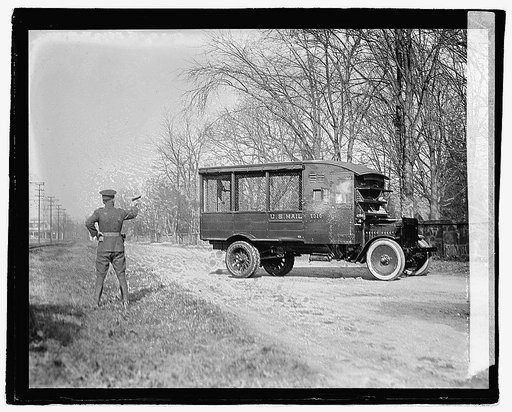 Tests of the new Armoured trucks of the Post Office Department at Fort Meyer today. The windows and wind shields are of bullet proof glass. This photo snaped [sic] at the moment of impact, plainly shows the fine splinters of flying glass, 12/1/21