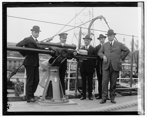 Navy Secretary Edwin Denby (far right) and Treasury Secretary Andrew Mellon (third from right) aboard the new U.S. Coast Guard cutter Modoc, prior to its first sailing, at the Washington Navy Yard, April 1922