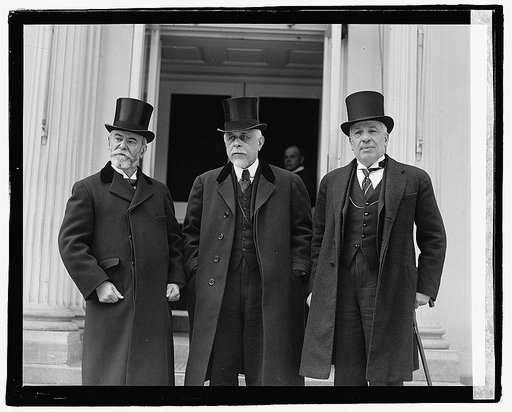 Three unidentified men on steps of building], 5/1/22