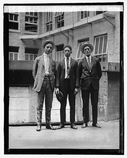 Garland Carr (center) arrested for trying to blow up Veterans Bureau, 6/21/22