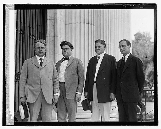 Four men standing outside building], 7/2/22