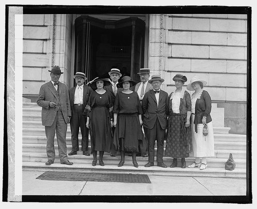 Group of unidentified men and women standing on steps outside building], 8/2/22