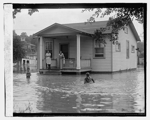 Children on porch of house surrounded by flood], 9/2/22