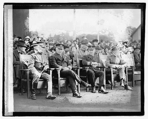 Bolling Field Air Circus, October 25, 1922 - Starting 2nd from left: Admiral Strauss, Admiral Rogers, and Captain Mustin watching the Air Circus] 10/25/22