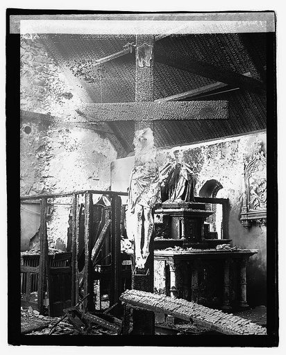 Crucifix in burned church interior], 10/26/22