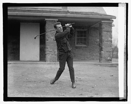 Man swinging golf club