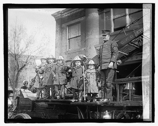 Midgets [children in fire fighther costumes