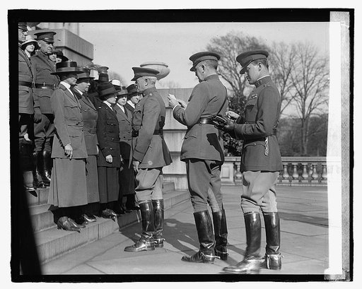 Unidentified uniformed women and men, ceremony on steps