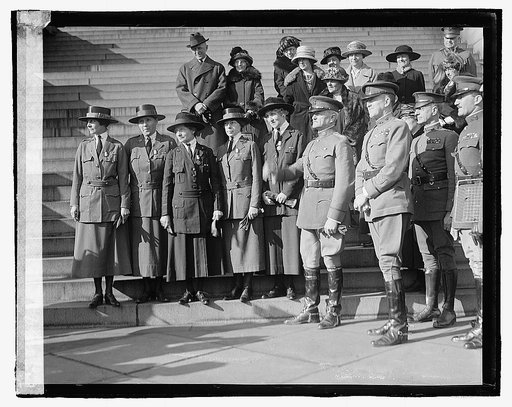 Unidentified uniformed women and man, ceremony on steps