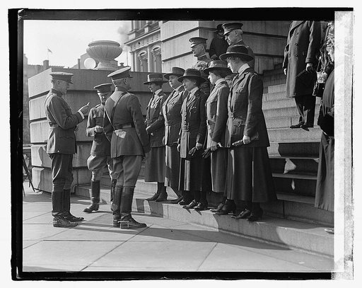 General Pershing and unidentified group on steps