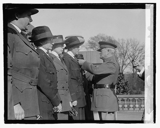 Pershing and unidentified uniformed women on steps
