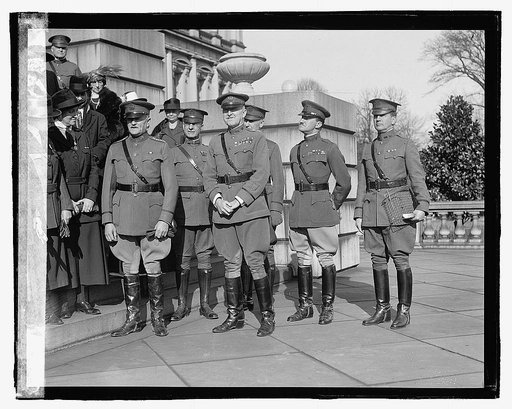 Unidentified uniformed men, ceremony on steps