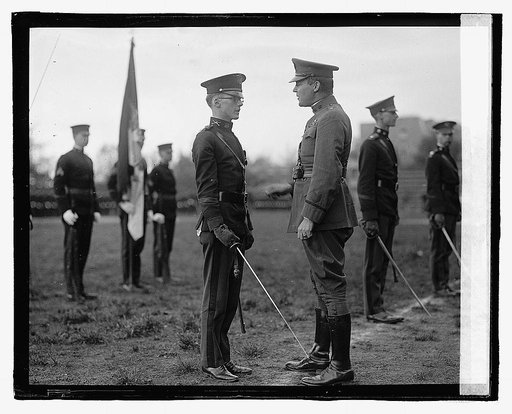 Unidentified uniformed men participating in ceremony
