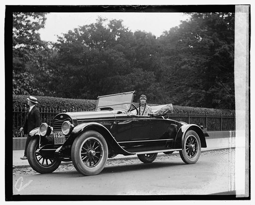 Woman wearing native american clothing in automobile