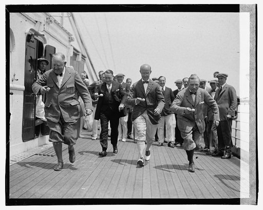 Men running on deck of ship