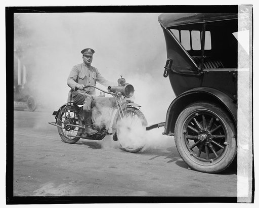 Police on motorcycle trailing car with smoke], 9/1/23