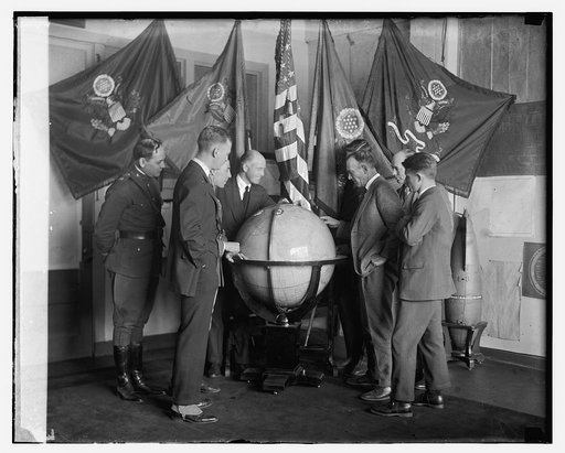 Unidentified group viewing globe], 1/12/24
