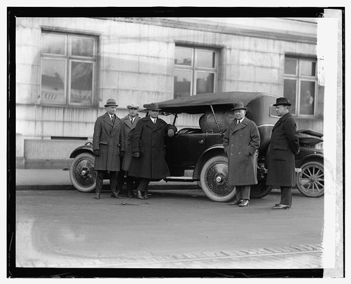 Five men standing with automobile