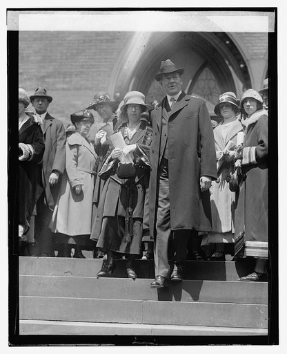 Secty. & Mrs. Wilbur leaving church, 4/21/24