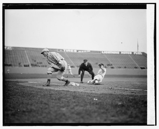 Senators Joe Judge safe at third in third inning on passed ball as Philadelphia A's third baseman Sammy Hale loses throw. Umpire is Billy Evans. A's won 6-1