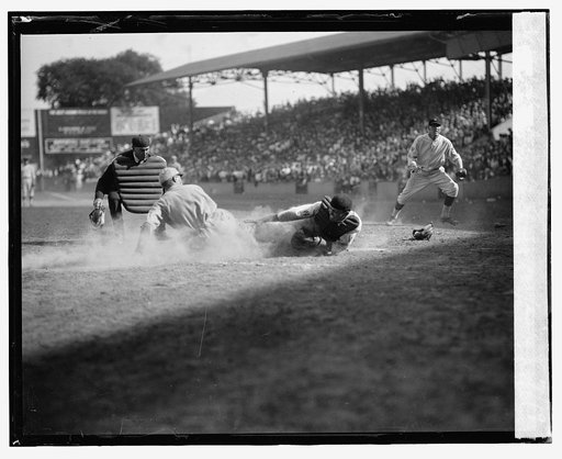 The Browns Wally Gerber safe at home with winning run in tenth inning. Senators catcher is Benny Tate. Umpire is Dick Nallin and Senators pitcher in background is Allan Russell. Browns won 10-9
